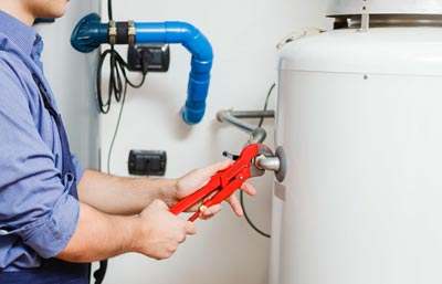 Electrician engineer reparing a electric cylinder boiler