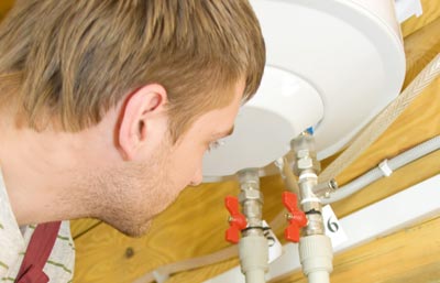 Electrician engineer reparing an electric boiler