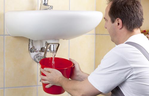 Drainage engineer repairing a internal drain